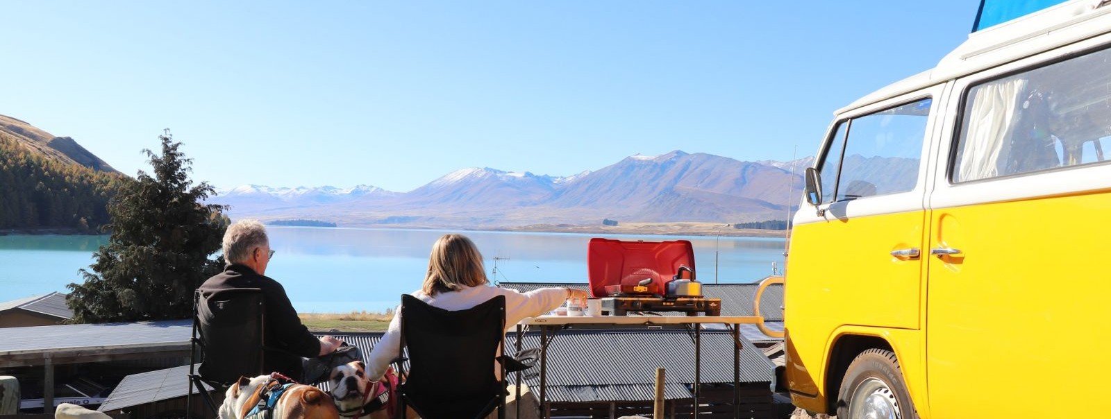 Holiday Park Tekapo Lakefront Dog And Friends Camping In A Van Having Breakfast